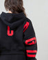 Black hoodie with red lettering on a plain background