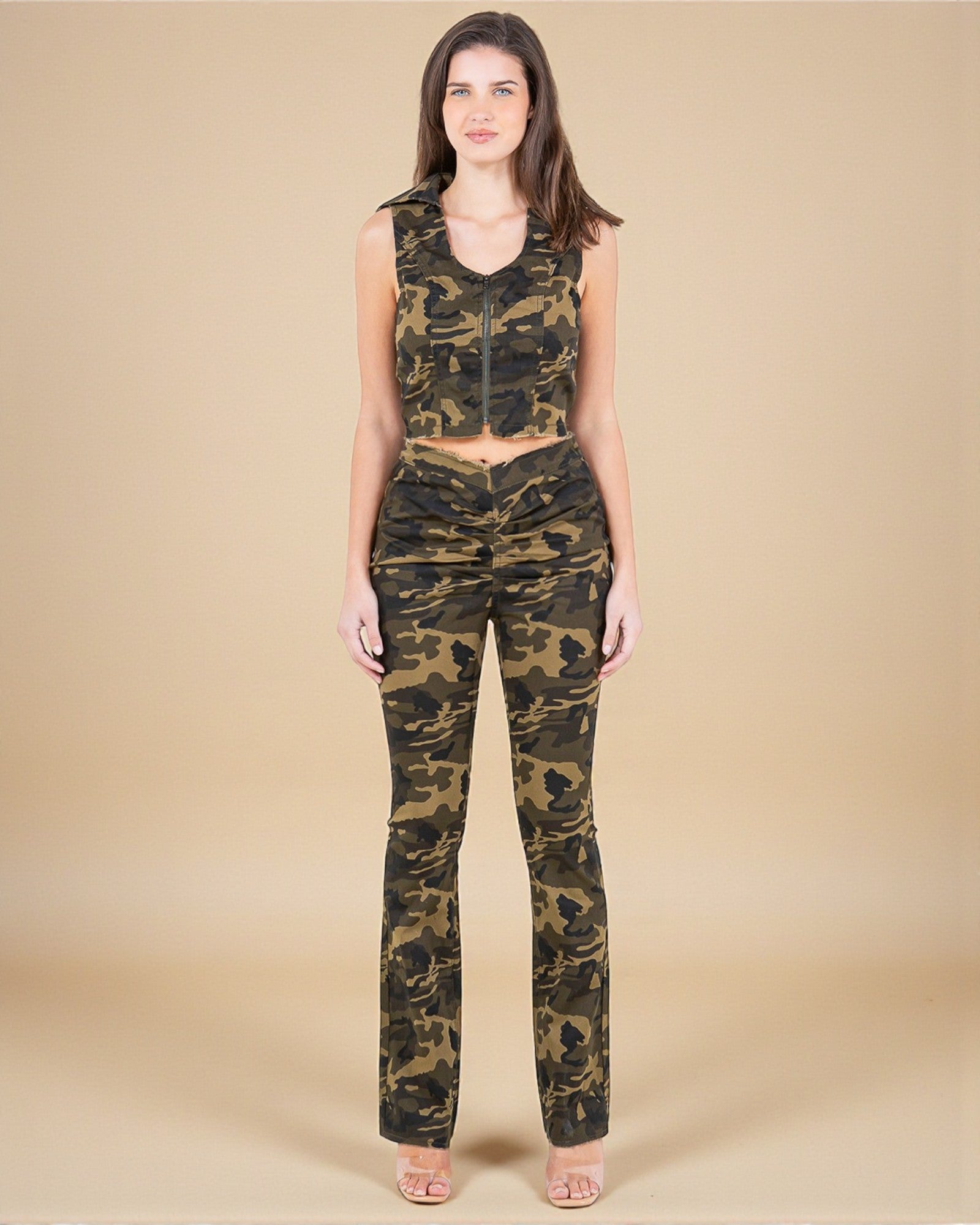 Woman wearing a camouflage outfit on a beige background