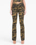 A model wearing camouflage pants with a ruched front detail, paired with a matching camouflage crop top, shown against a plain white background.