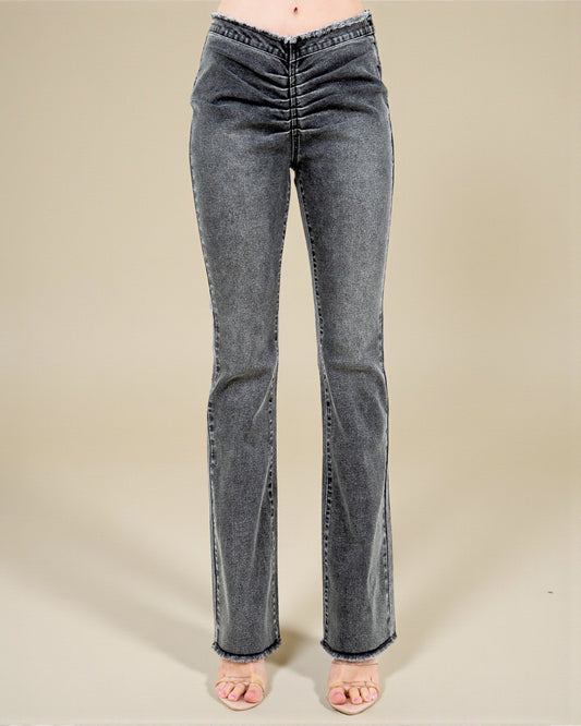 Gray jeans on a beige background