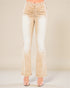 Beige flared jeans on a plain background