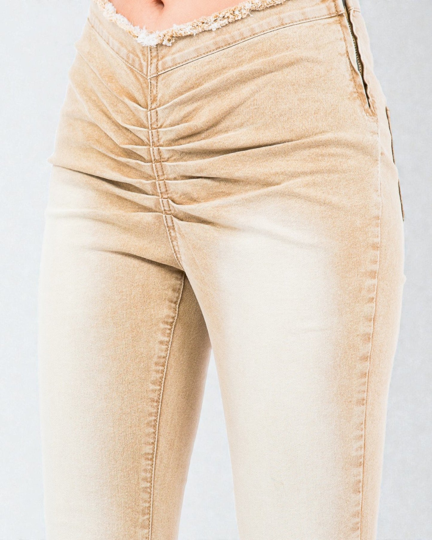 Beige jeans on a plain background