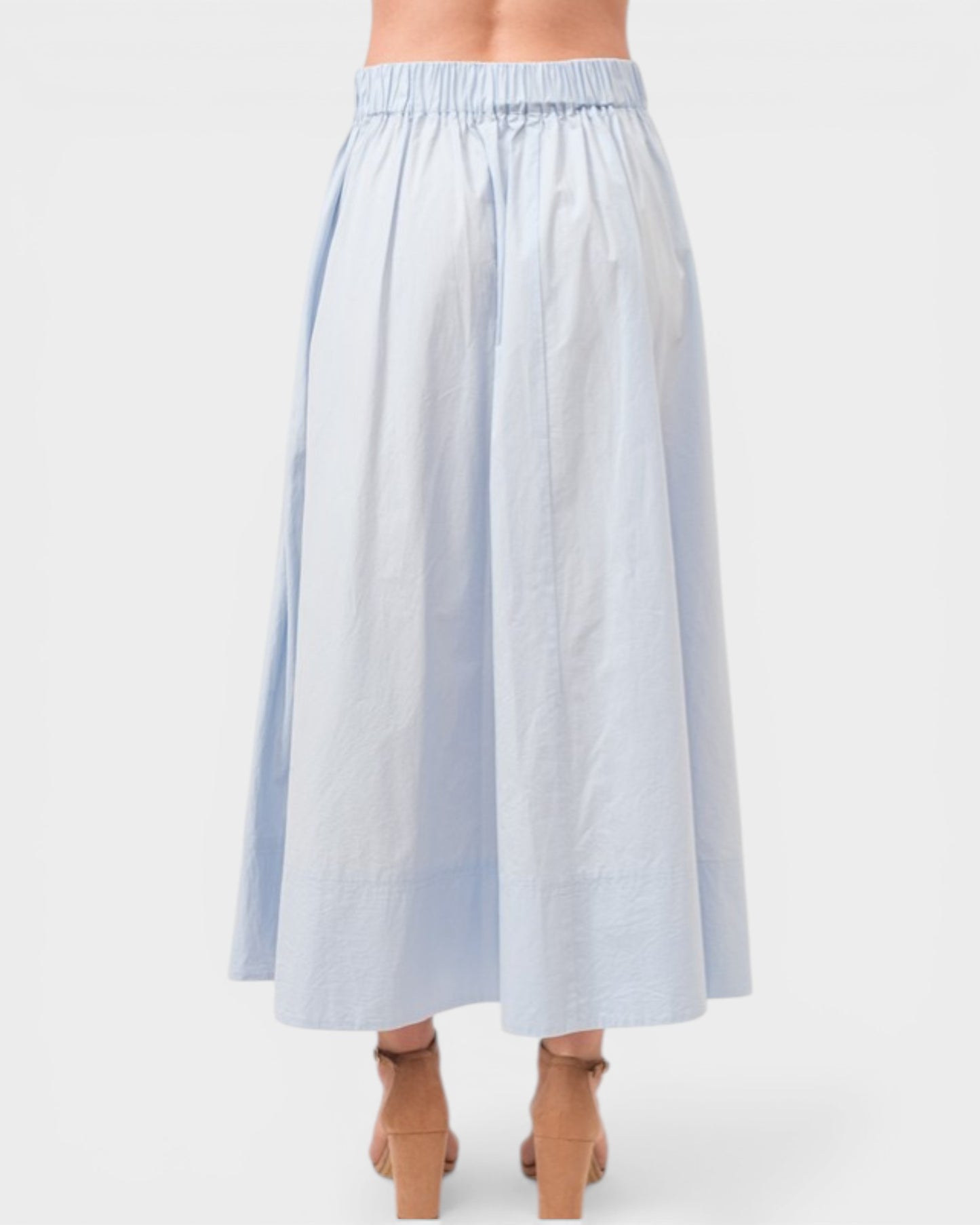Light blue striped skirt worn by a person on a white background