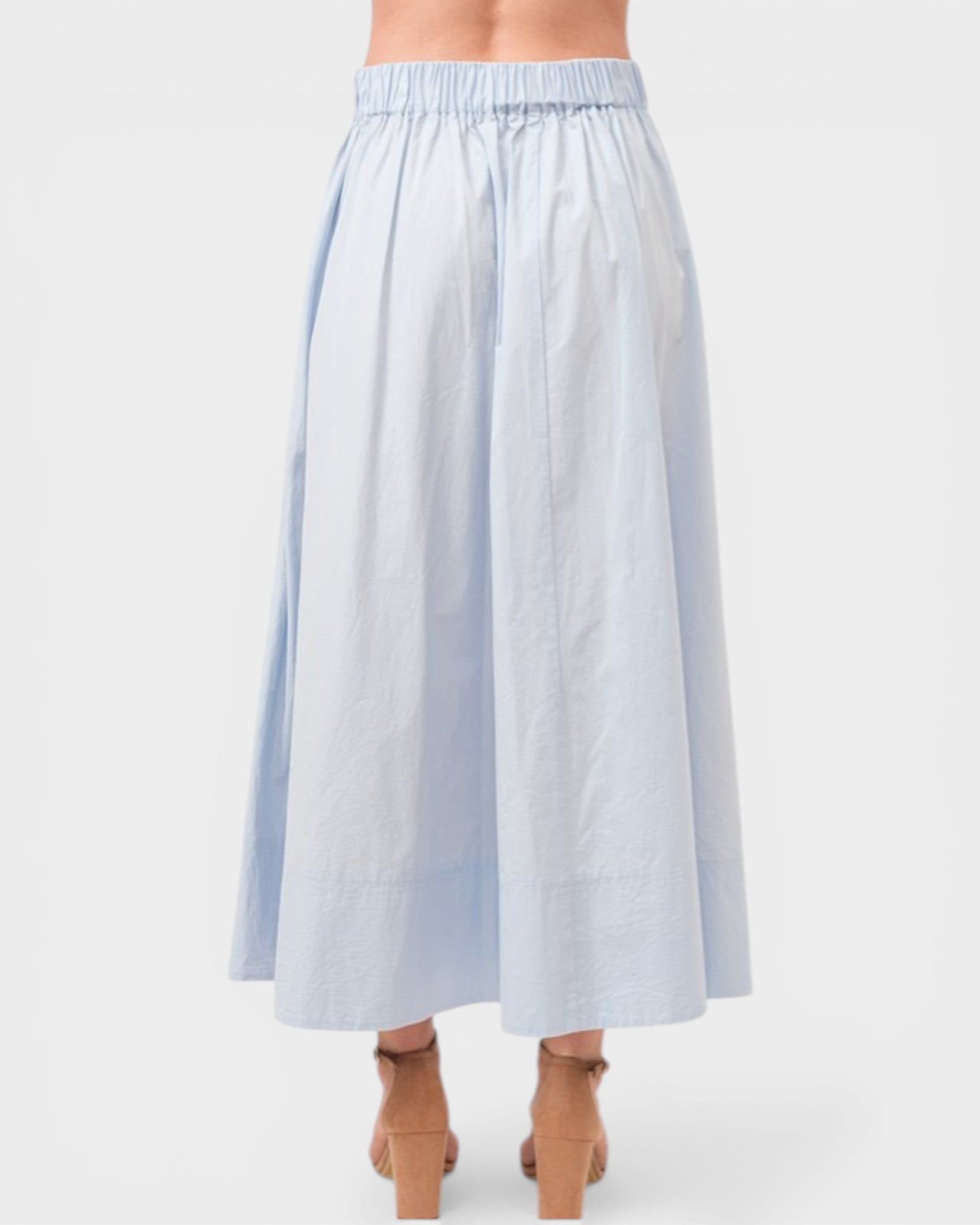 Light blue striped skirt worn by a person on a white background