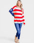 Person wearing a sweater with an American flag design on a white background