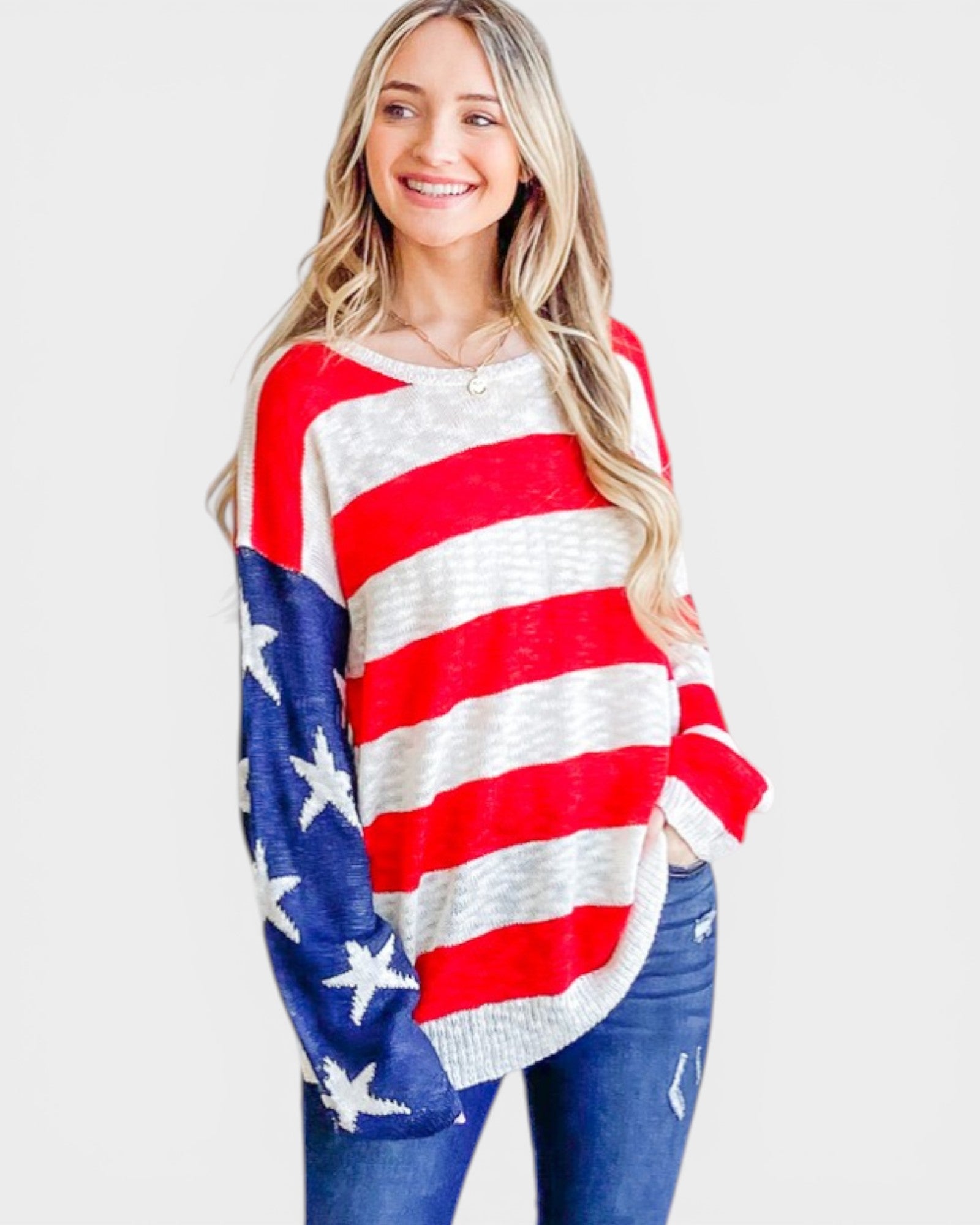 Woman wearing a red, white, and blue striped sweater with star details on a white background