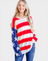 Woman wearing a red, white, and blue striped sweater with star details on a white background