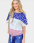 Woman wearing a top with American flag design on a plain background