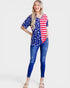 Woman wearing an American flag shirt and blue jeans on a white background