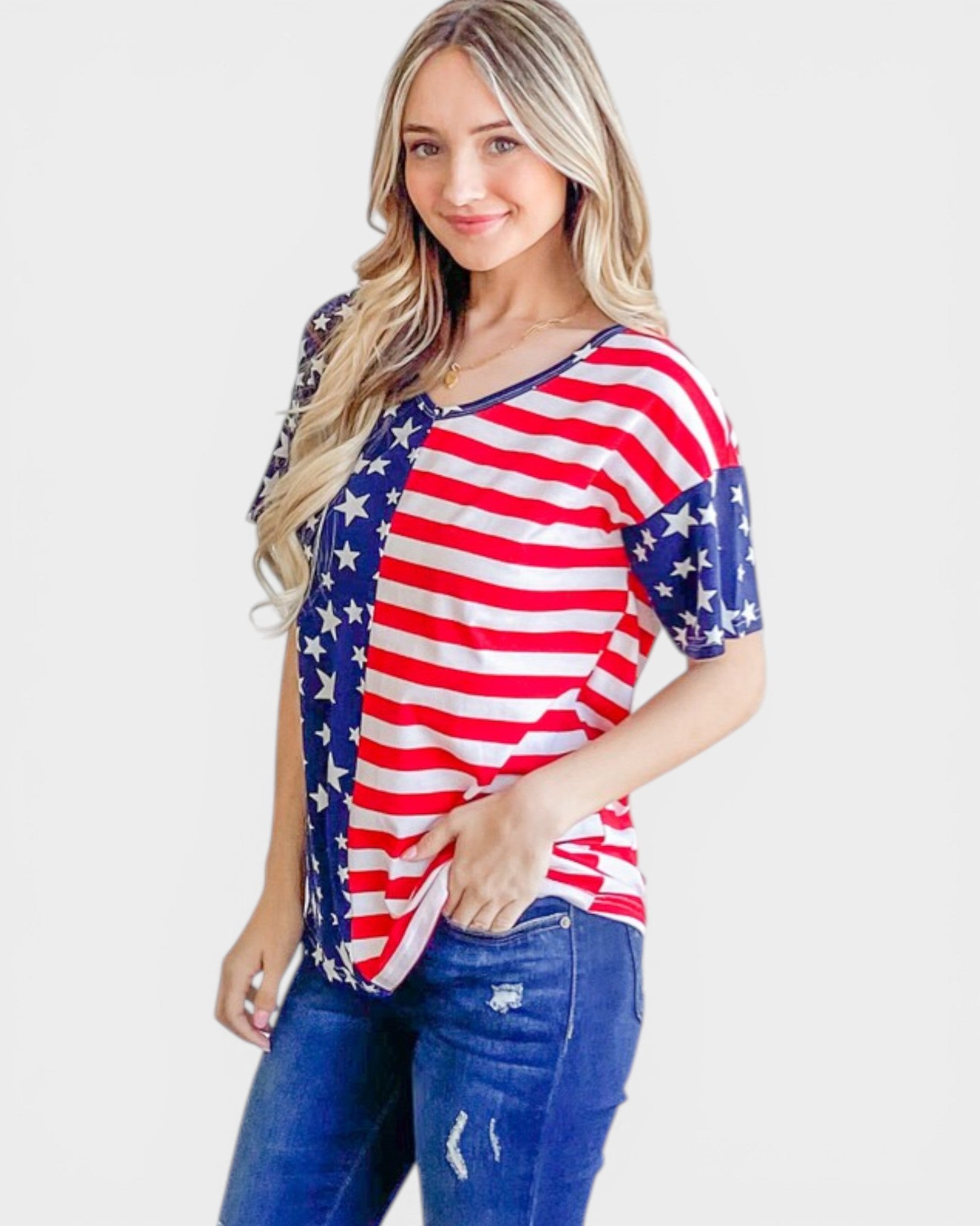 Woman wearing a shirt with an American flag design on a white background