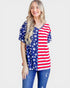 Woman wearing a red, white, and blue American flag shirt on a white background