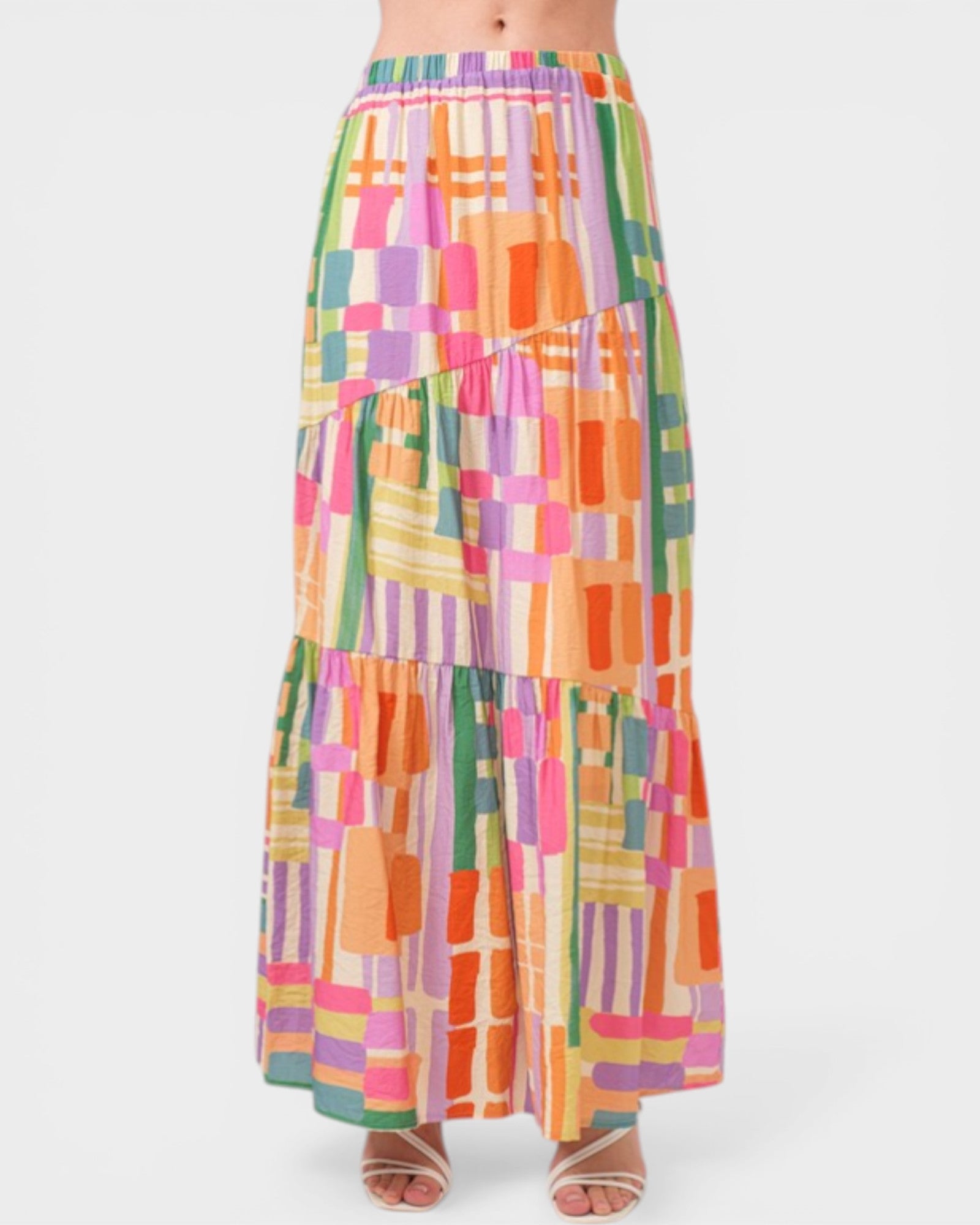 Colorful geometric patterned skirt on a white background
