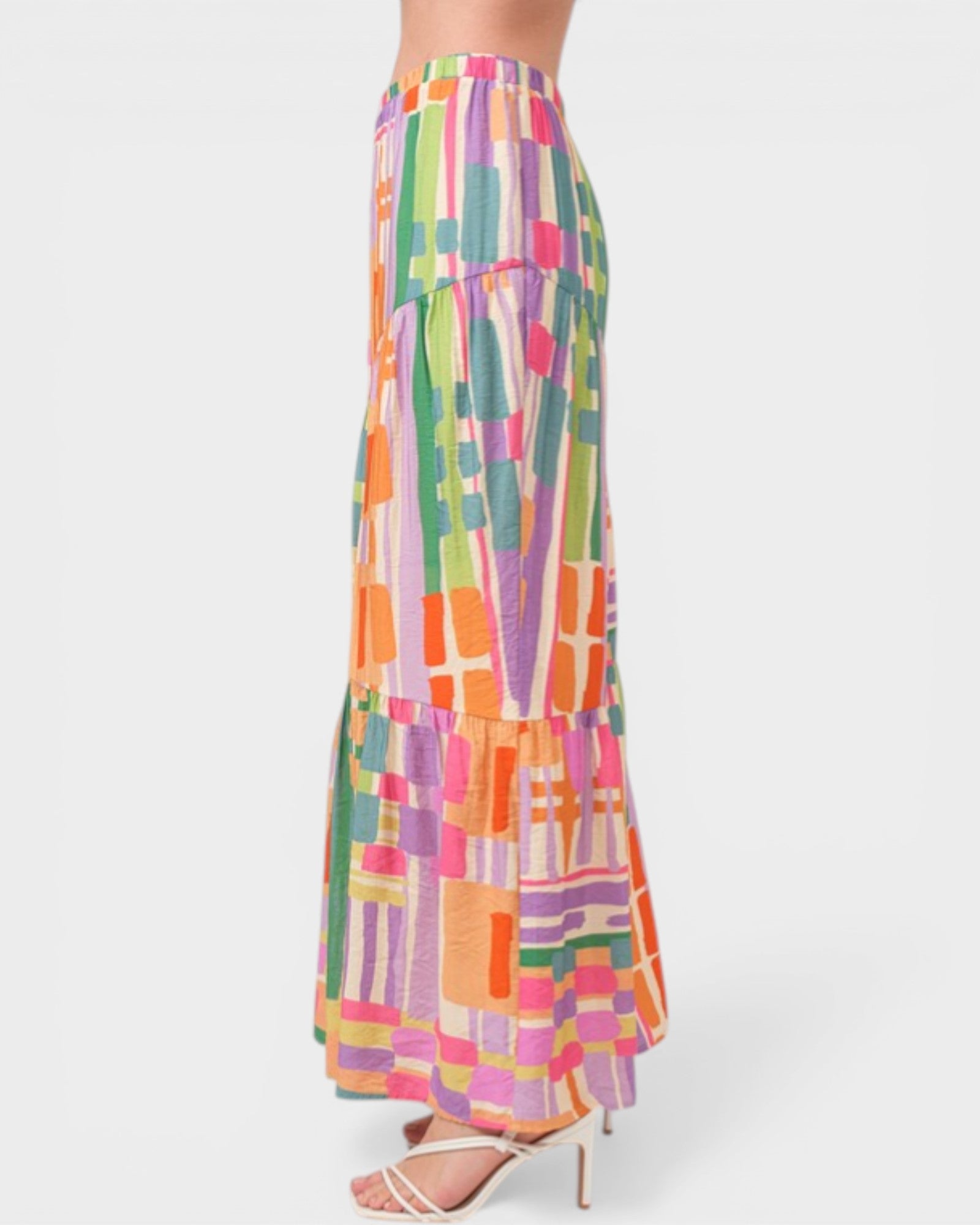 Multicolored geometric patterned skirt on a white background