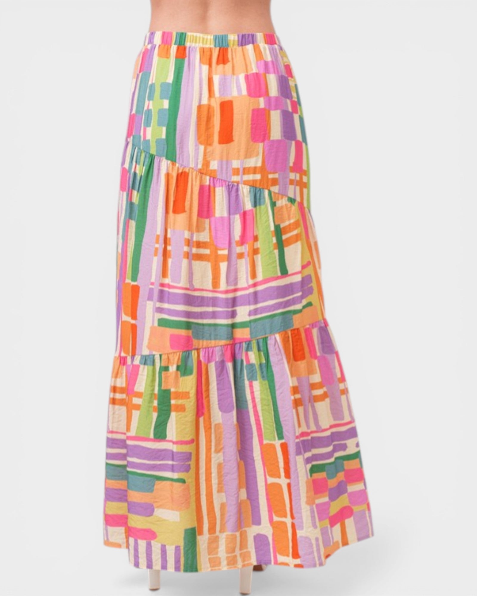 Colorful geometric patterned skirt on a white background