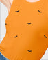 Close-up of a person wearing a bright orange ribbed sleeveless top with small black bat motifs scattered across the front, paired with blue jeans.