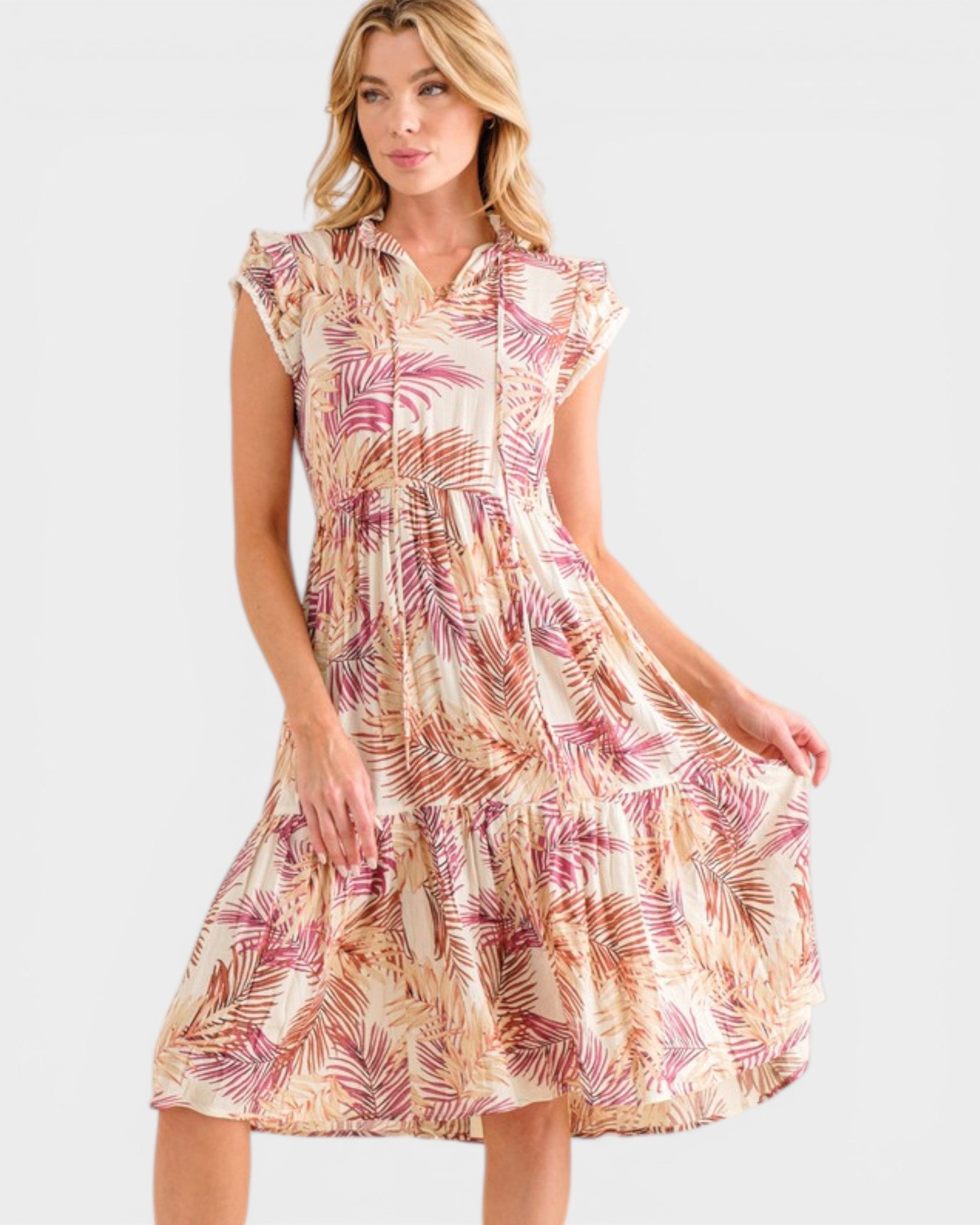 Woman wearing a floral dress on a white background