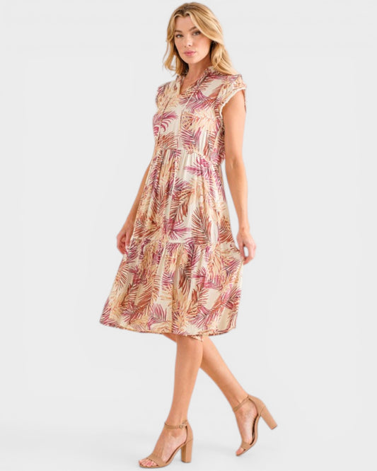 Woman wearing a patterned dress on a white background