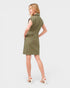 Woman wearing a green dress on a white background