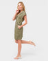 Woman wearing a green dress on a white background