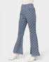 Checkered bell-bottom pants on a mannequin against a white background