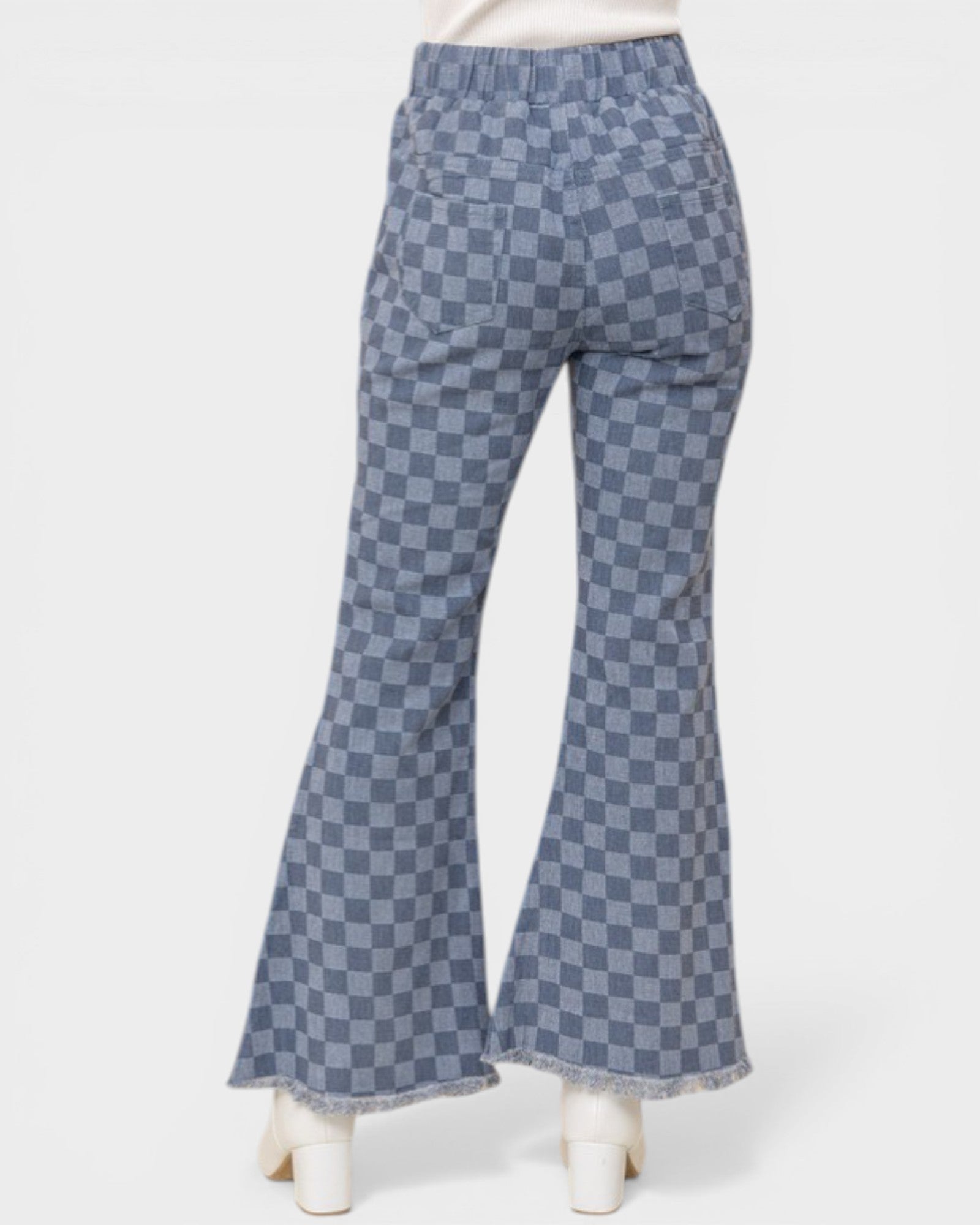Checkered bell-bottom pants on a white background
