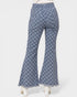 Checkered bell-bottom pants on a white background