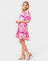 Woman wearing a colorful dress on a white background