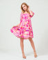 Woman wearing a colorful dress on a white background