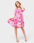 Woman wearing a colorful dress on a white background