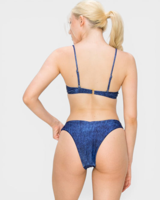 Woman wearing a blue denim bikini set on a white background
