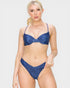 Woman wearing a blue bikini set on a plain background