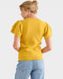 Person wearing a yellow sweater and blue jeans on a white background
