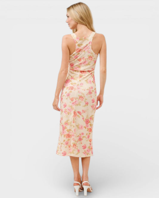 Woman wearing a floral one-shoulder dress on a white background