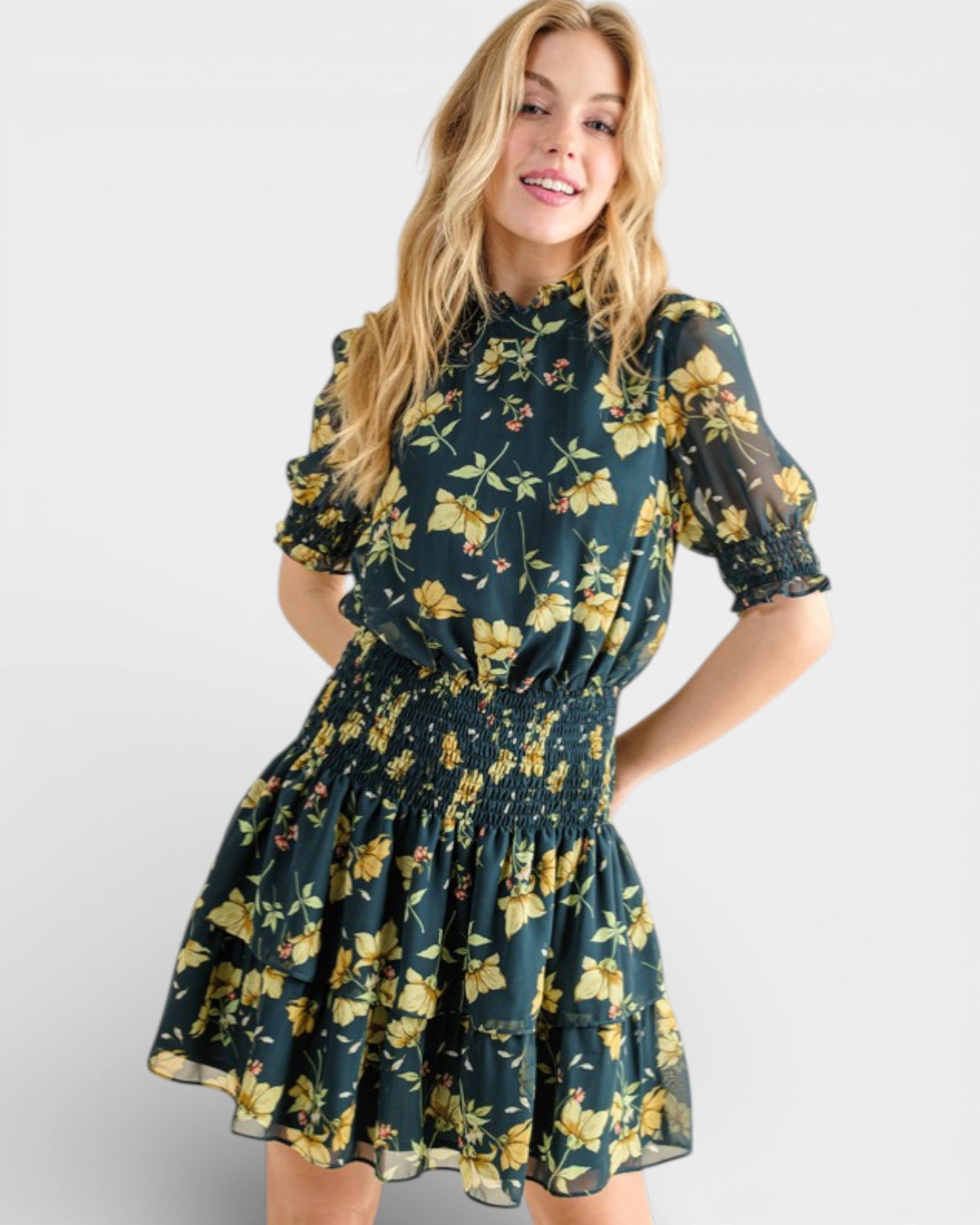 Woman wearing a floral dress with a plain background
