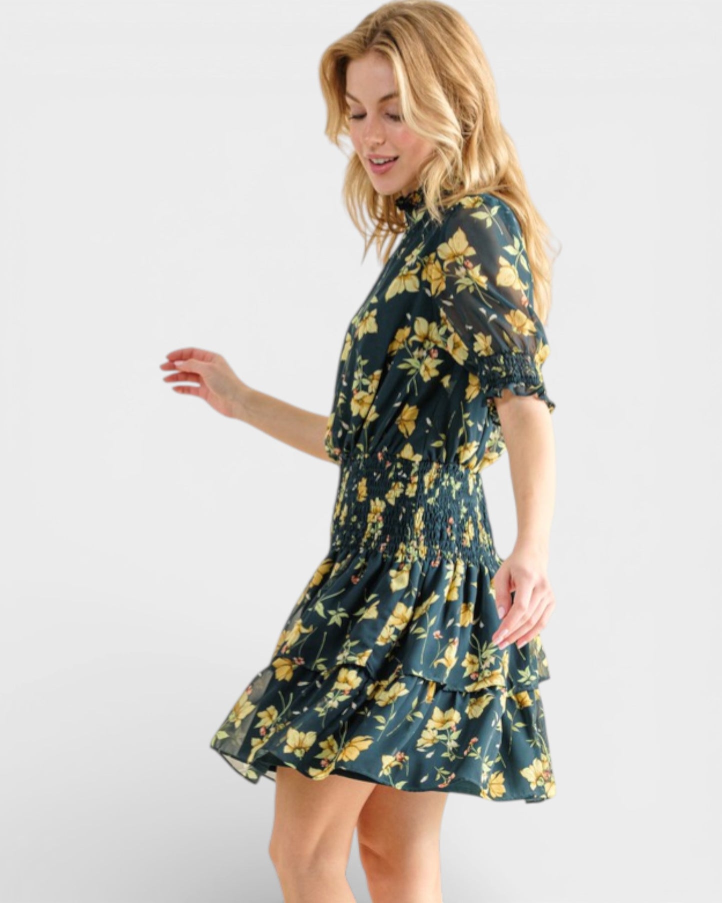 Woman wearing a floral dress on a white background