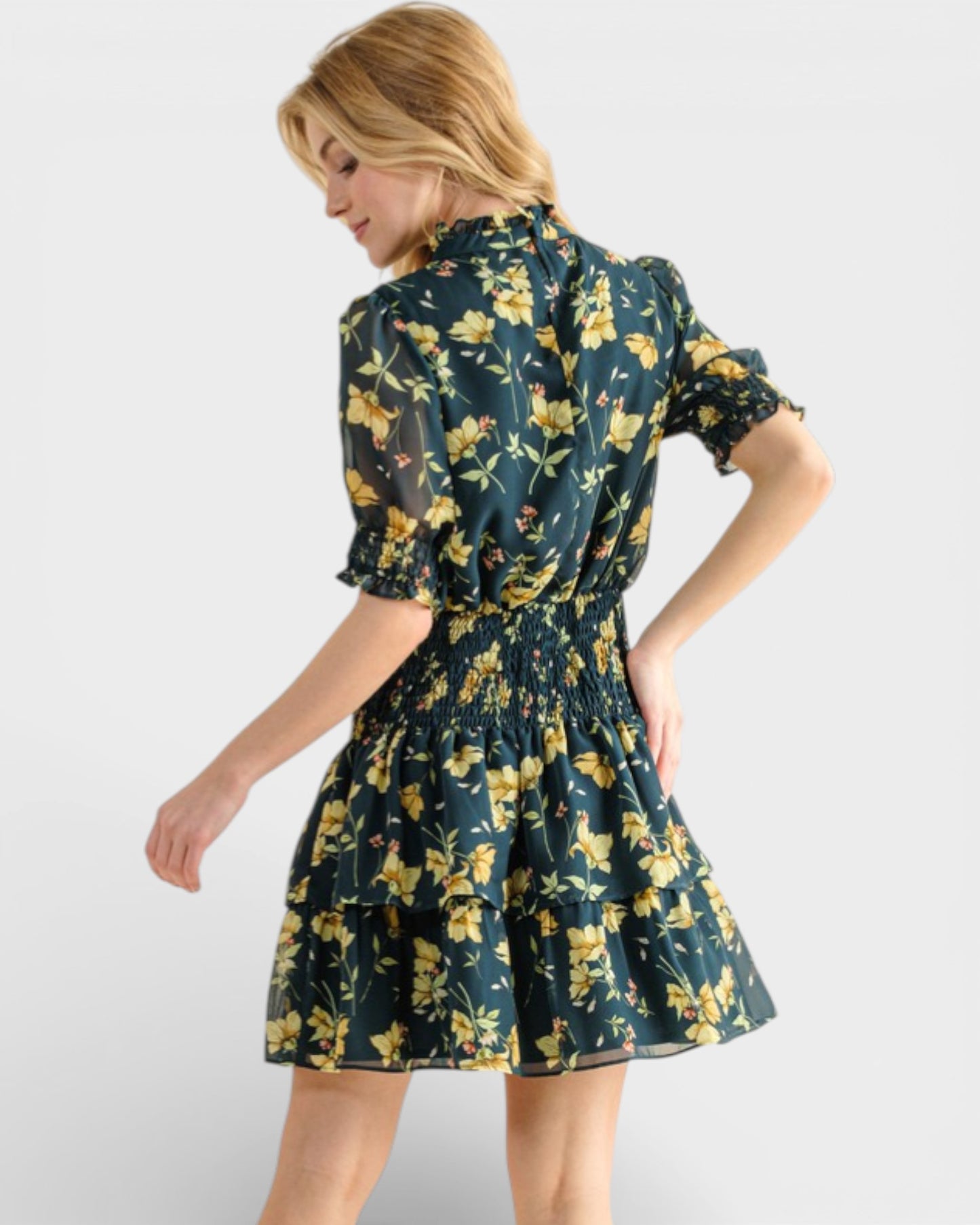 Woman wearing a floral dress with a white background