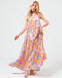 Woman wearing a colorful floral dress on a white background