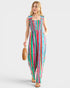 Woman wearing a colorful striped jumpsuit on a white background