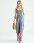 Woman wearing a colorful striped jumpsuit on a white background
