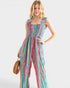 Woman wearing a colorful striped jumpsuit on a white background