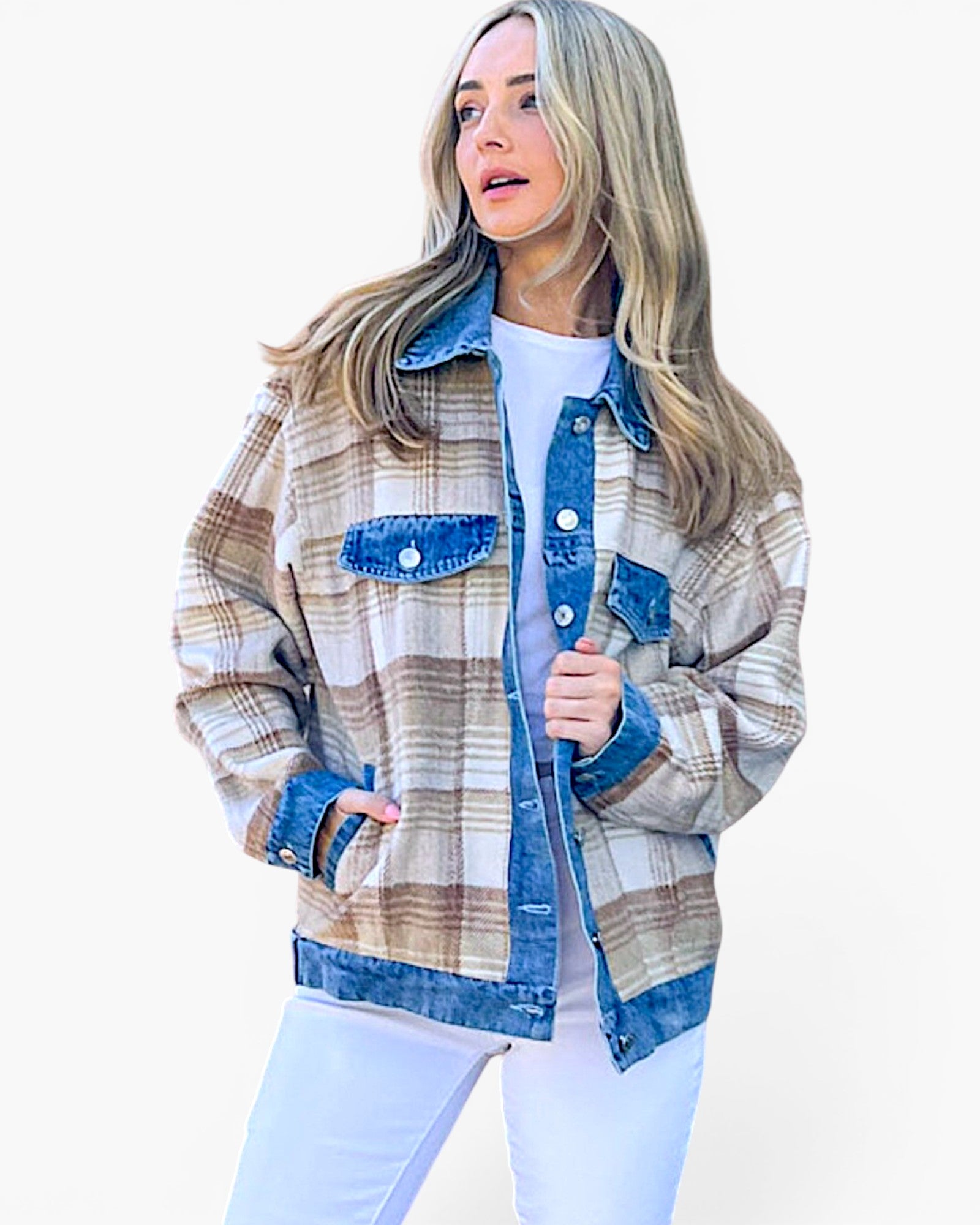 A woman wearing a plaid button-up jacket with blue denim trim, layered over a white t-shirt and white pants, set against a plain white background.