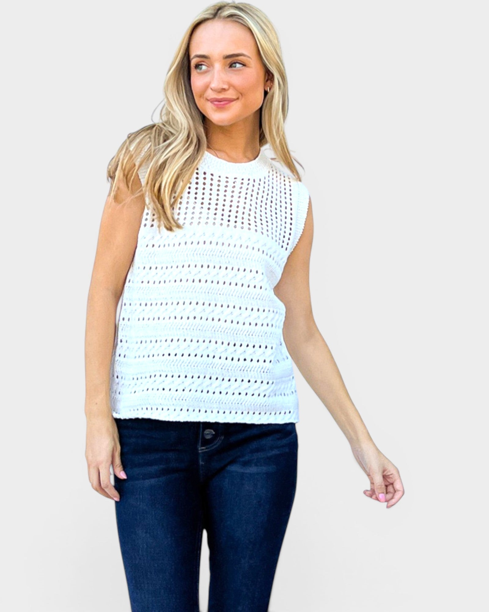 Woman wearing a light blue sleeveless top with a white background