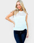 Woman wearing a light blue sleeveless crochet top and dark jeans on a white background