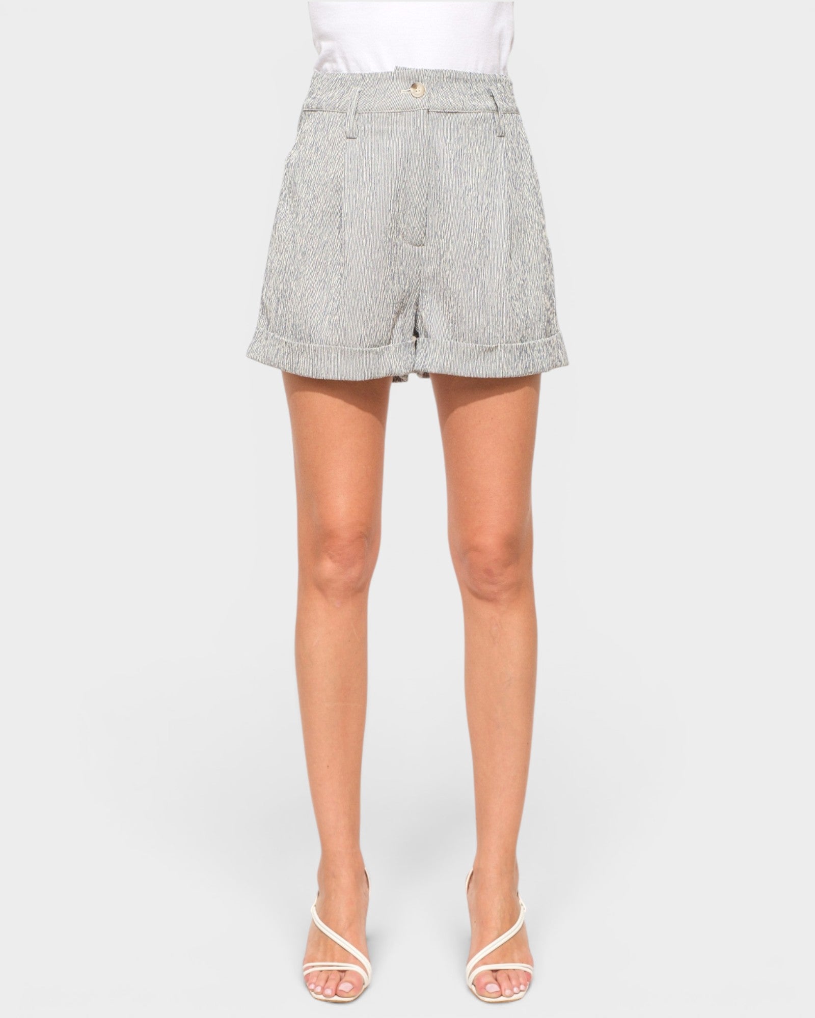 Gray shorts worn by a person on a white background