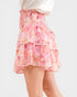 Pink and orange floral tiered skirt on a white background