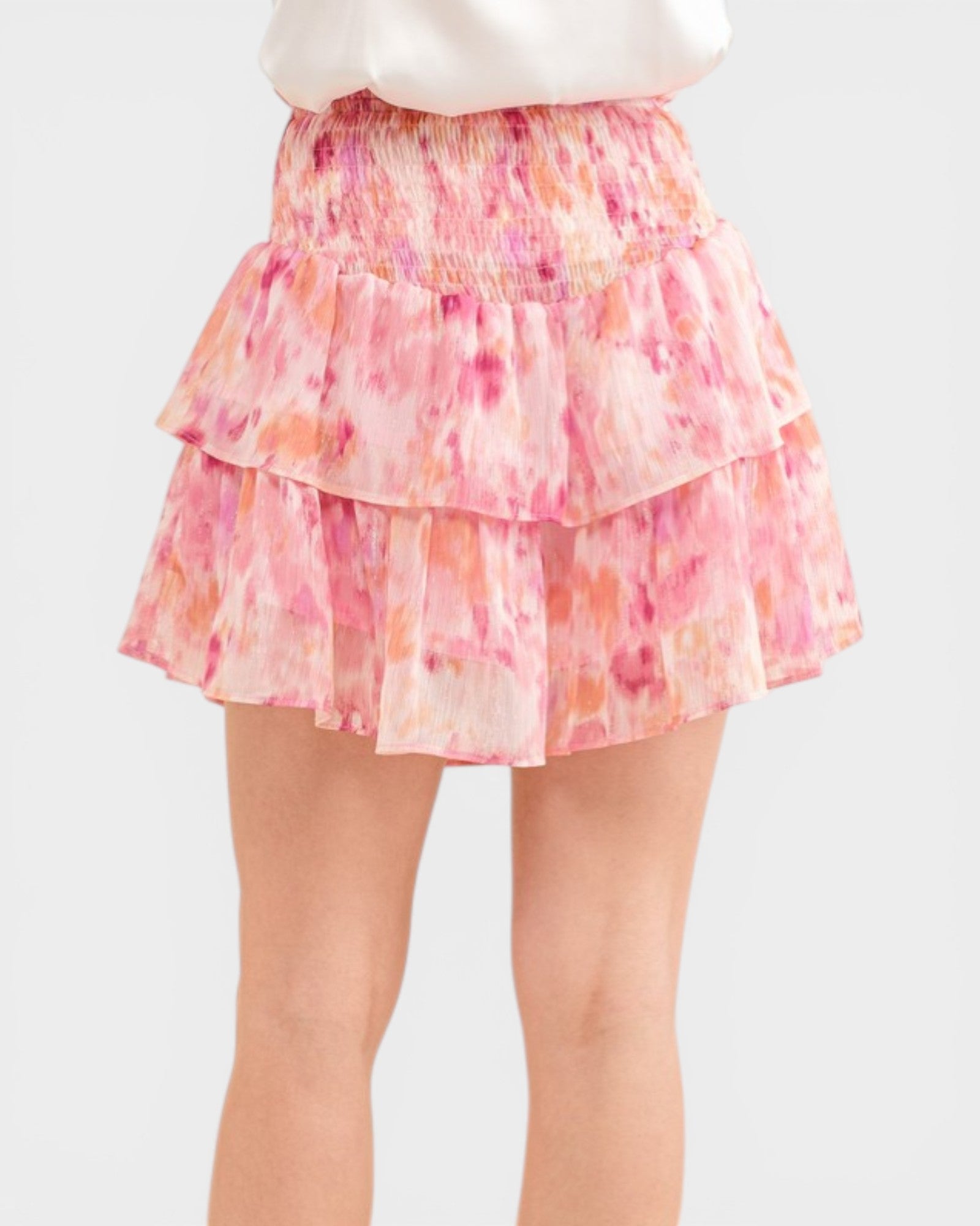 Pink and orange tiered skirt on a white background