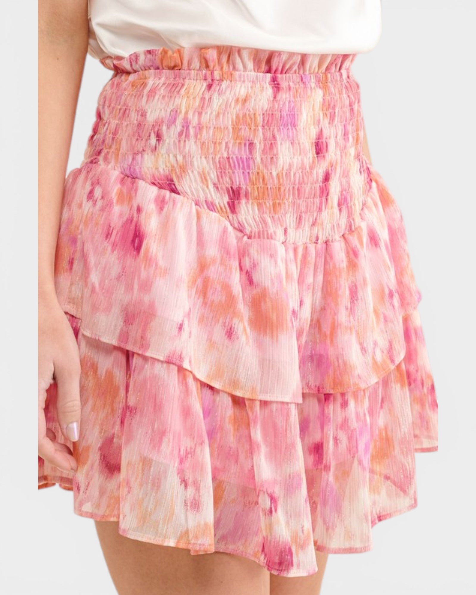 Pink and orange tie-dye skirt on a white background