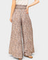 Patterned wide-leg pants worn by a person on a plain background