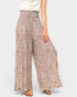 Floral patterned wide-leg pants worn by a person on a white background