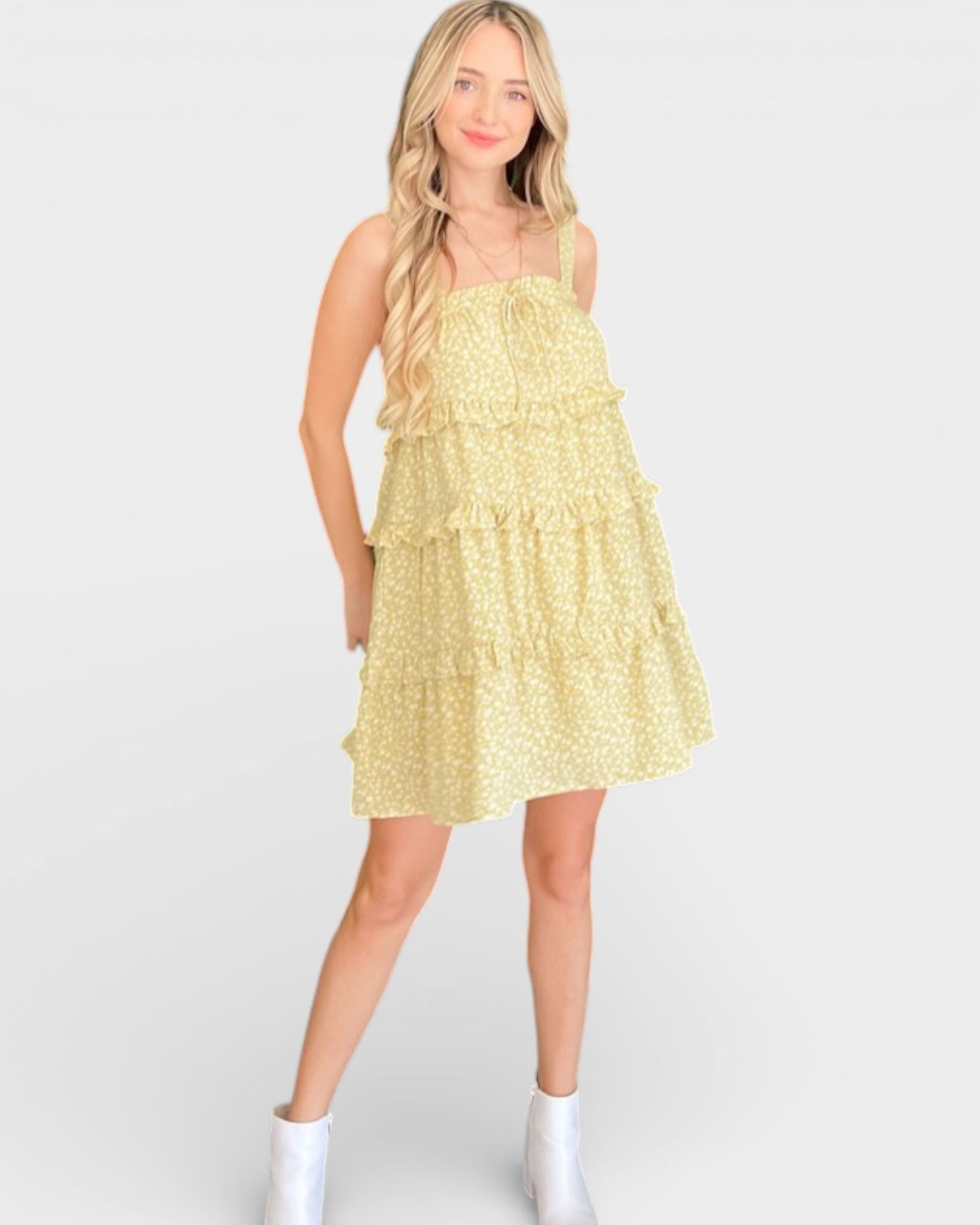 Woman wearing a yellow dress with a white background